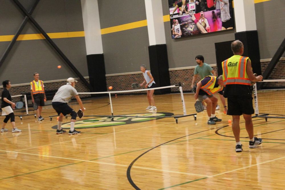 Several doubles games running side by side at the Fieldhouse